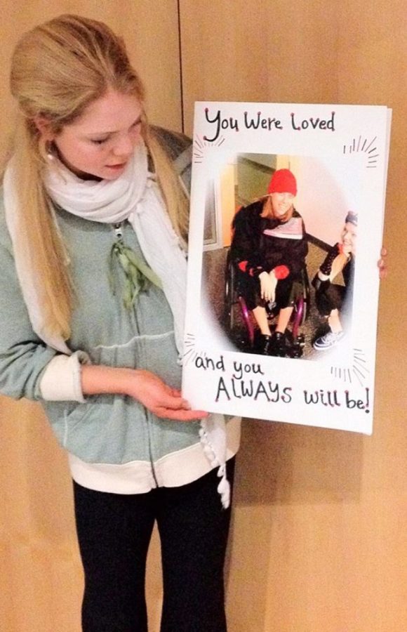 	Elizabeth Brewer holds a picture of Jessica Stebbins who, after death, continued to inspire a group of students to start a new yoga class at the Student Recreational Center(Photo courtesy of Elizabeth Brewer). 