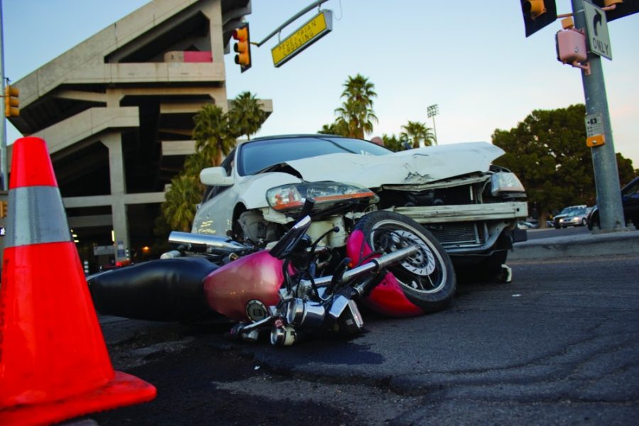 Hailey Eisenbach /  Arizona Daily Wildcat

Car accident involving a motorist and motorcycle on 6th Street and Highland Avenue on the evening of Wednesday, January 9.