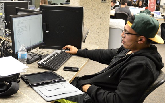 Ryan Revock /  Arizona Daily Wildcat

Lucas Meza, a public administration and policy senior, uses a computer in the UA Main Library Information Commons.  Meza was studying for an upcoming exam.    