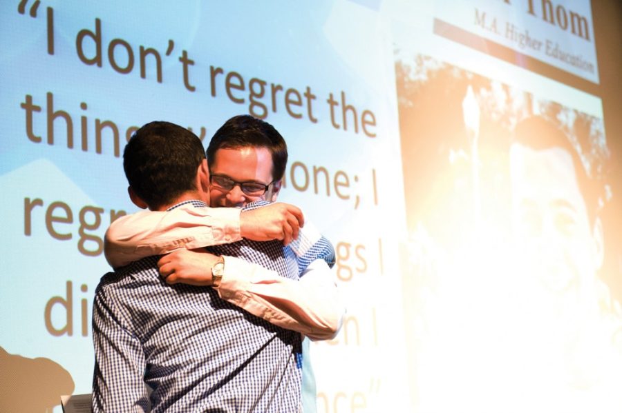 Tyler Besh/Arizona Daily Wildcat

Higher Education Graduate, Daniel DeHollander, hugs senior Tyler Thom after his heart-felt remarks.