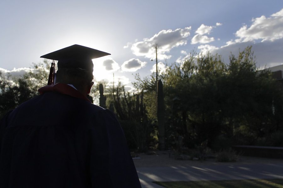 	UA graduates took senior photos around campus as they prepared for commencement. Some professors offered graduates advice as they prepare for life after graduation. 