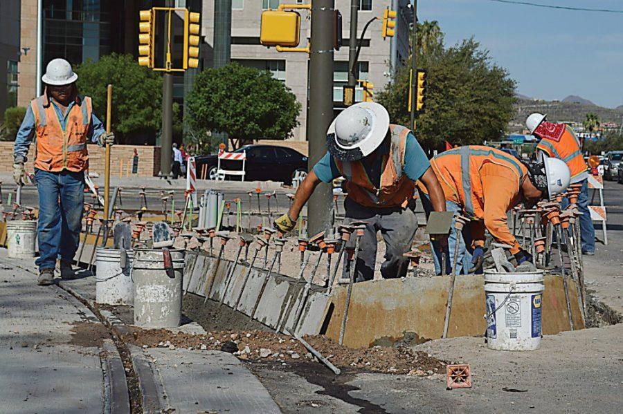 Ryan Revock / Arizona Daily Wildcat

Construction workers continue to work on the streetcar tracks at the intersection of North Granada Avenue and West Congress Street Monday morning.  The workers were constructing a new median for a turning lane.  