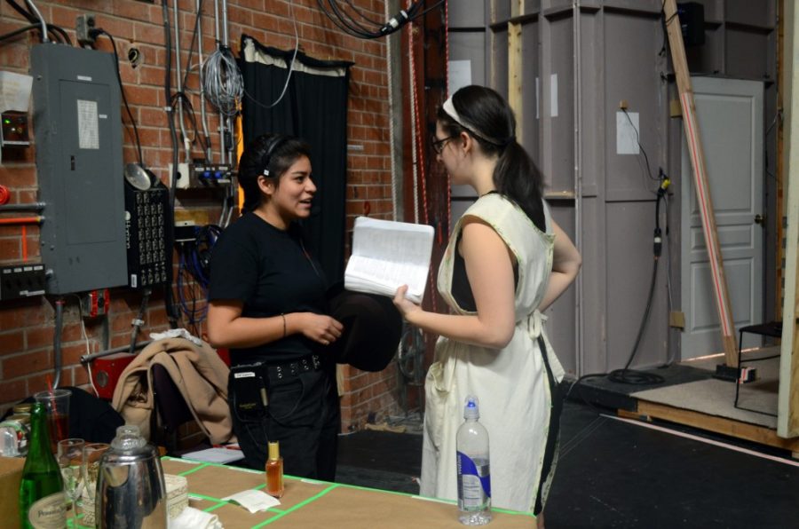 Grace Pierson  / The Daily Wildcat

Lindsey Mony, a musical theater senior, preps backstage with crew, Fatimah Amill, a theater production-tech and design sophomore, at the rehearsal for Boeing-Boeing on Saturday.  