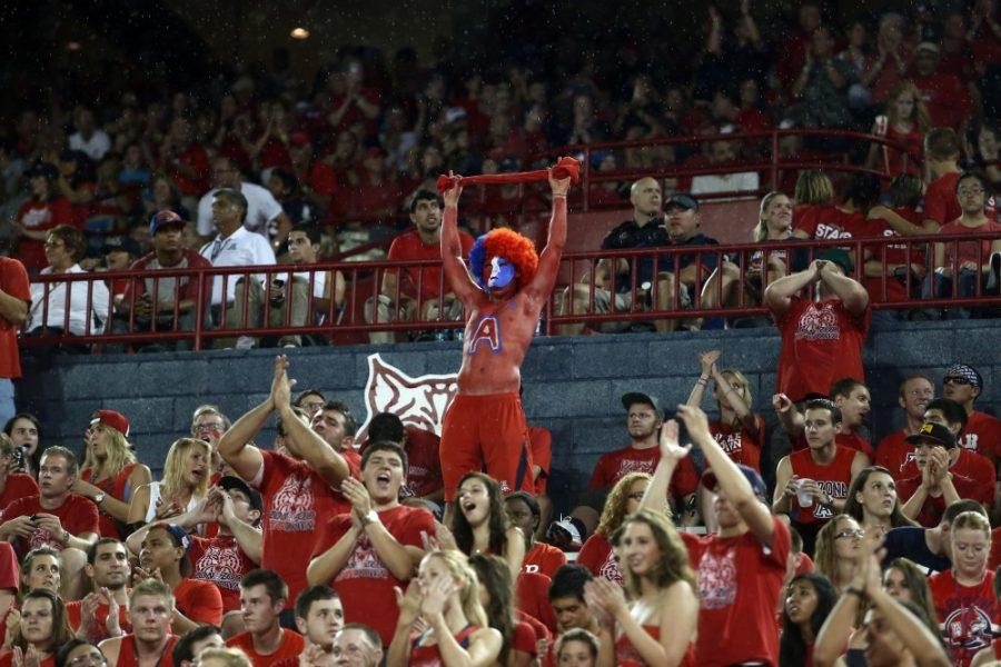 Tyler+Besh+%2F%2F+The+Daily+Wildcat%0A%0AStudents+in+the+ZonaZoo+section+cheer+at+the+football+game+on+Friday.