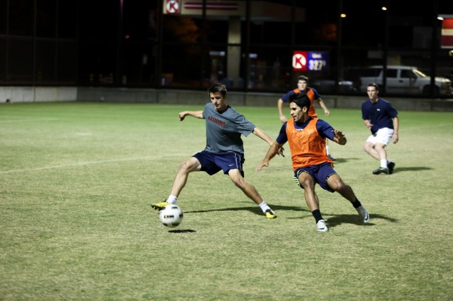 Keenan Turner / Arizona Daily Wildcat

Ethan Taplin, a forward on UAs Mens Club Soccer Team steps in front of a defender at practice on Tuesday.