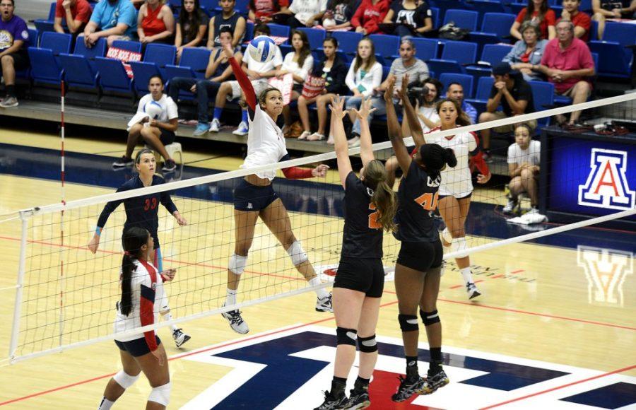 Ryan Revock / The Daily Wildcat

UA Middle Blocker Olivia Magill spikes the ball against Oregon State on Sunday.