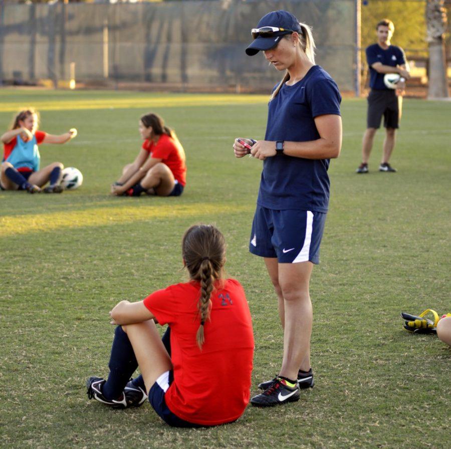 Cecilia Alvarez  / The Daily Wildcat

Coach Kylie Louw interacts with the players on Tuesday, Oct. 8. 2013. The wildcats are preparing to travel out to Oregon State for a match on Friday night. 
