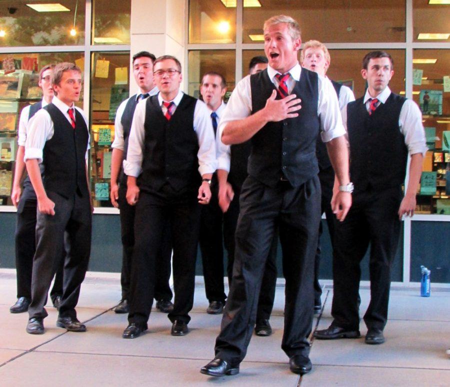 Savannah Douglas/ Arizona Daily Wildcat

The University of Arizonas all male CatCall Acapella group performs on campus every Monday at five in the afternoon. Bobby Way, a current member of CatCall, leads the group performance on Monday, Sept. 30, 2013. 