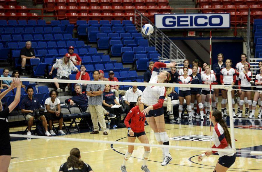 Ryan Revock / The Daily Wildcat

UA Outside Hitter, Madi Kingdon, spikes the ball against Wofford on Sept. 21.  

