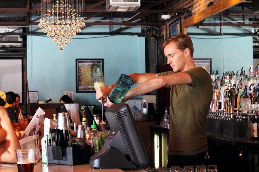 Amy Johnson / Arizona Daily Wildcat

Bronson Valiquet-Myers, bartender at Sky Bar on Fouth Avenue, prepares a drink for a patron in the late afternoon. Valiquet-Myers has been working at Sky Bar for four years. 