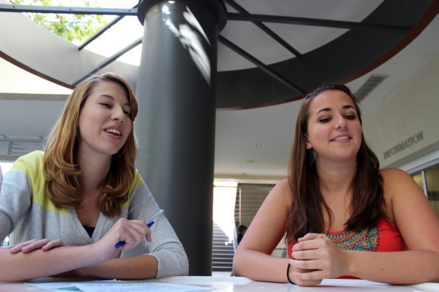Kimberly Cain / The Daily Wildcat

Chloe Cavelier d Esclavelles (right), communications senior, and Cassandra Ott (left), business administration senior, discuss the new club on campus, Aspiring Woman Professionals on Friday. They are the co-founders of the Aspiring Woman Professionals club.