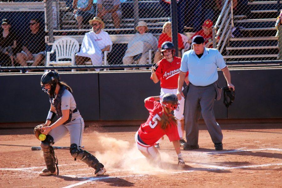 Kimberly Cain/ The Daily Wildcat

Hallie Wilson, english and journalism junior, slides into home at the game against Scottsdale on Sunday.