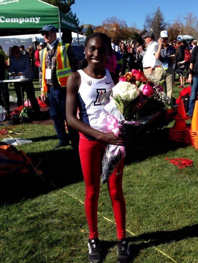 Photo courtesy of Arizona Athletics

Elvin Kibet receives flowers after placing second at the Pac-12 Championship on Saturday in Louisville Colo.  