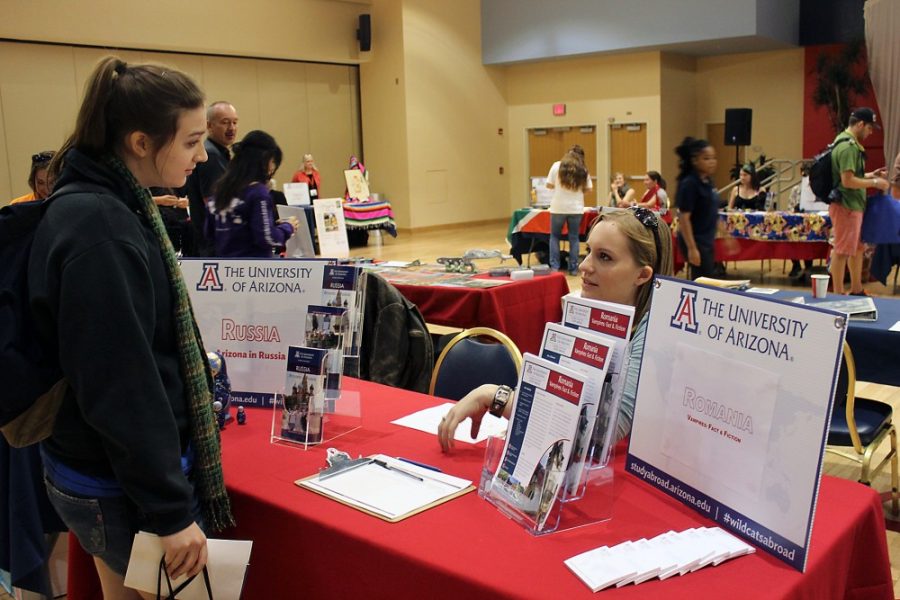 Savannah Douglas  / The Daily Wildcat

Megan McNaughton (left), a global studies freshman, attends the University of Arizona study abroad fair on Wednesday at the UA Student Union memorial Center. McNaughton speaks with Sandra Sherman (right), a Russian and global studies senior, regarding the Russia study abroad program. 