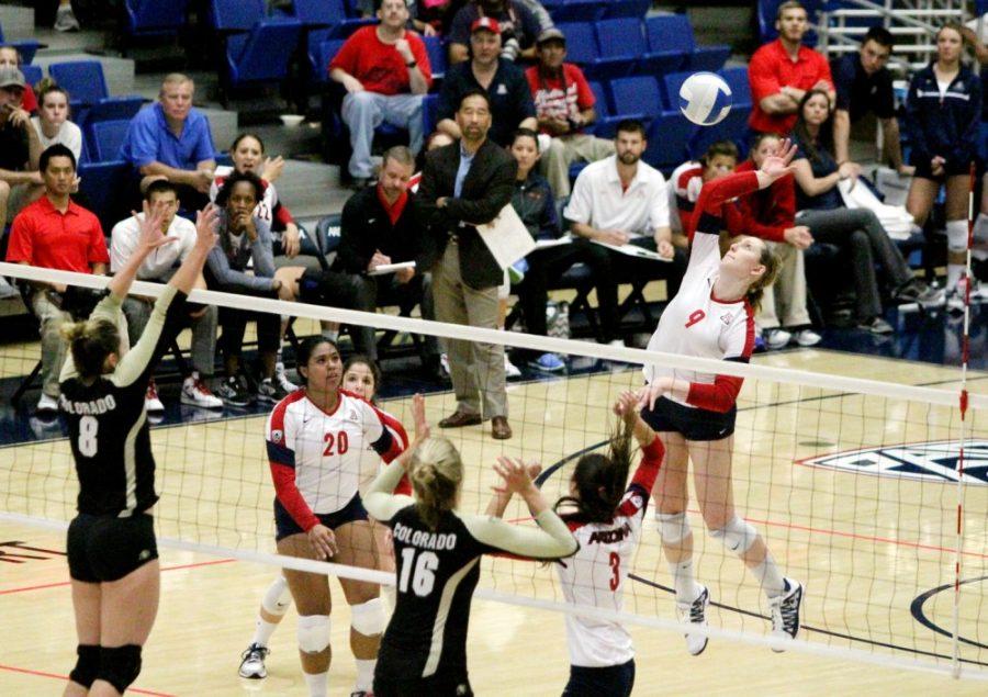 Amy Phelps / The Daily Wildcat

UA junior outside hitter Madi Kingdon spikes the ball against Colorado on Sunday at the McKale Center.  