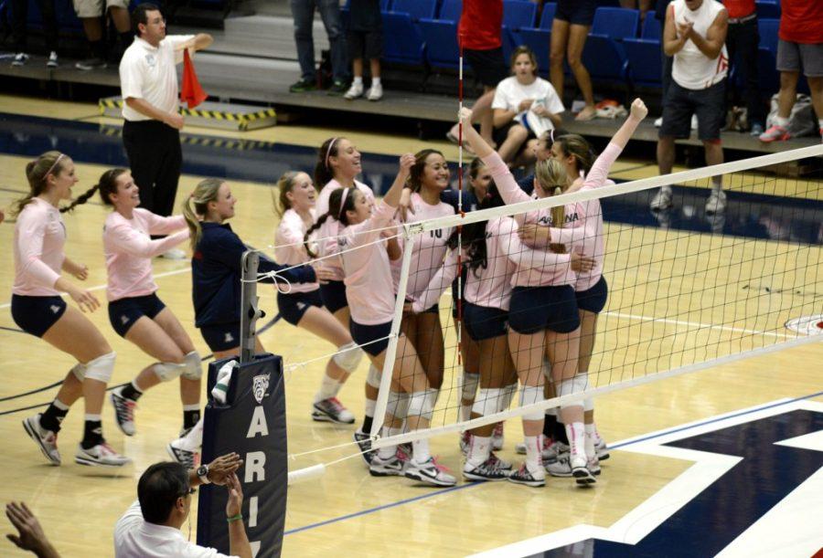 Ryan+Revock%2F+The+Daily+Wildcat%0A%0AThe+UA+volleyball+team+celebrates+on+the+court+moments+after+defeating+No.+1+USC+on+Oct.+20+in+the+McKale+Center.+++