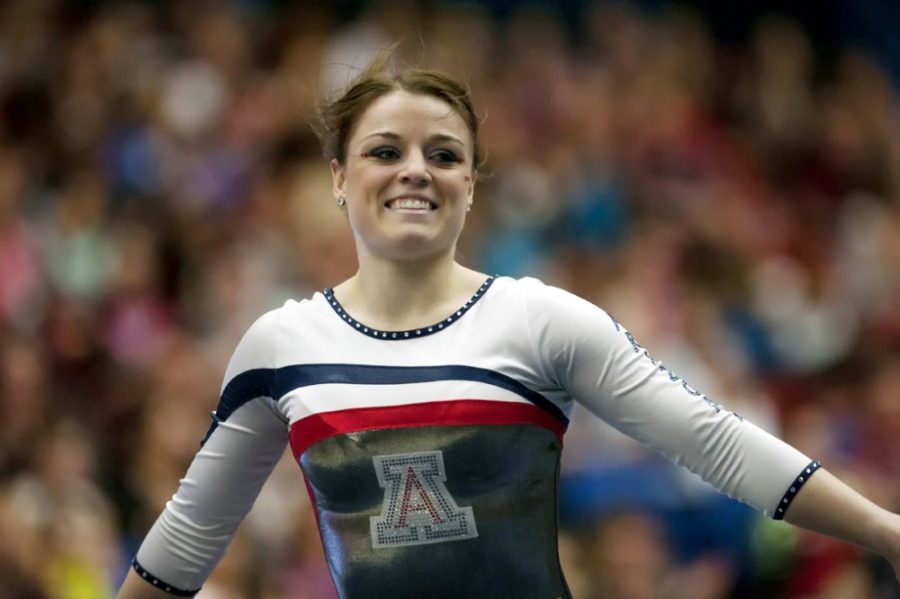 Carlos+Herrera+%2F+The+Daily+Wildcat%0A%0AJunior+all-around+Kristin+Klarenbach+smiles+after+her+floor+routine+in+McKale+Center+on+Saturday.+The+No.+17+UA+Gymcats+fell+to+No.+1+Oklahoma%2C+197.575-196.925%2C+in+front+a+crowd+of+2%2C166+on+Saturday+at+McKale+Center.+The+Gymcats+total+of+196.925+is+the+fifth-highest+score+in+program+history.