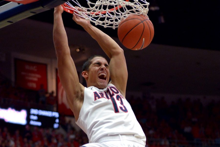 Tyler Baker/ The Daily Wildcat

Junior guard Nick Johnson dunks the ball during the second half of Arizonas 65-56 win over Utah at McKale Center on Sunday. 