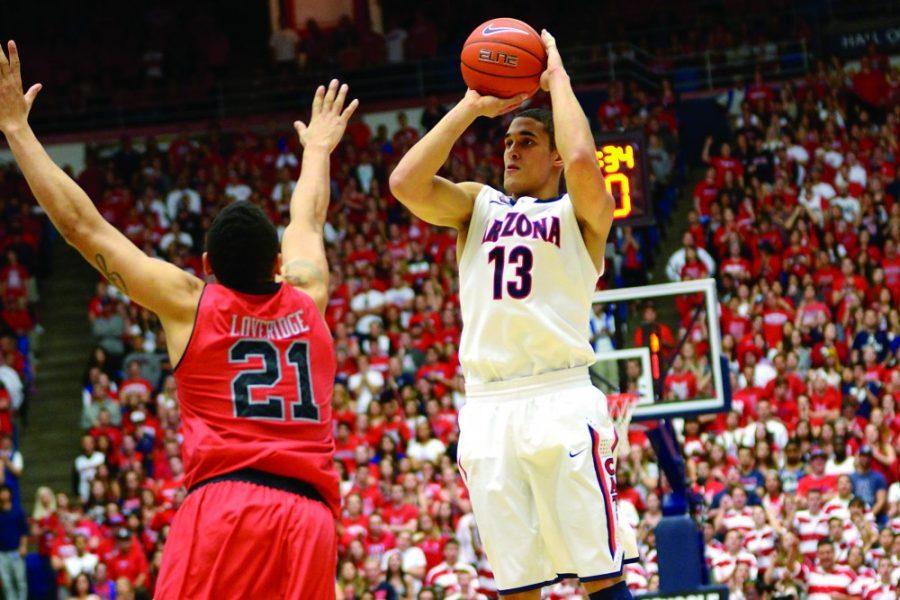 Tyler+Baker%2F+The+Daily+Wildcat%0A%0AJunior+guard+Nick+Johnson+shoots+a+3-point+jump+shot+during+Arizonas+65-56+win+against+Utah+at+McKale+Center+on+Sunday.