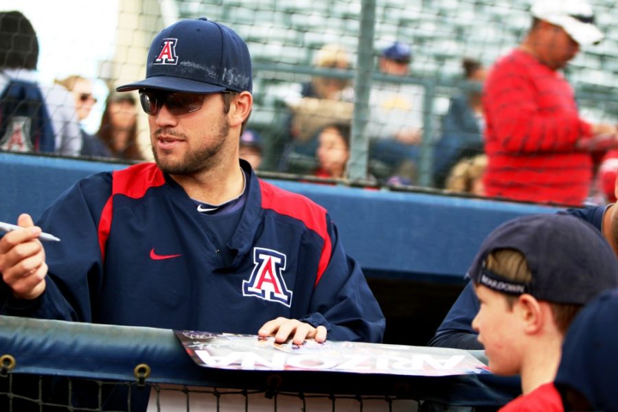 Cecilia Alvarez/ The Daily Wildcat

Junior pitcher Mathew Troupe signs autographs for young UA baseball fans on Feb. 1 at a meet and greet event. 

