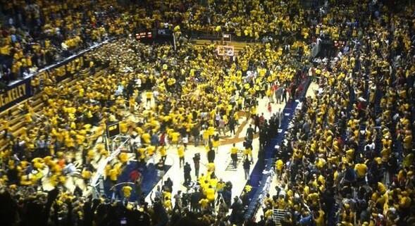 	Cal fans rush the Haas Pavilion court after the Golden Bears upset No. 1 Arizona on Saturday night.