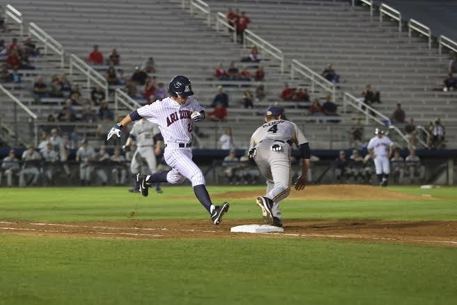 	Sophomore Scott Kingery runs towards first place during the opening season baseball game against Kent State at Hi Corbett field on Friday. Arizona won 13-1 and Kingery had one RBI and scored once.
