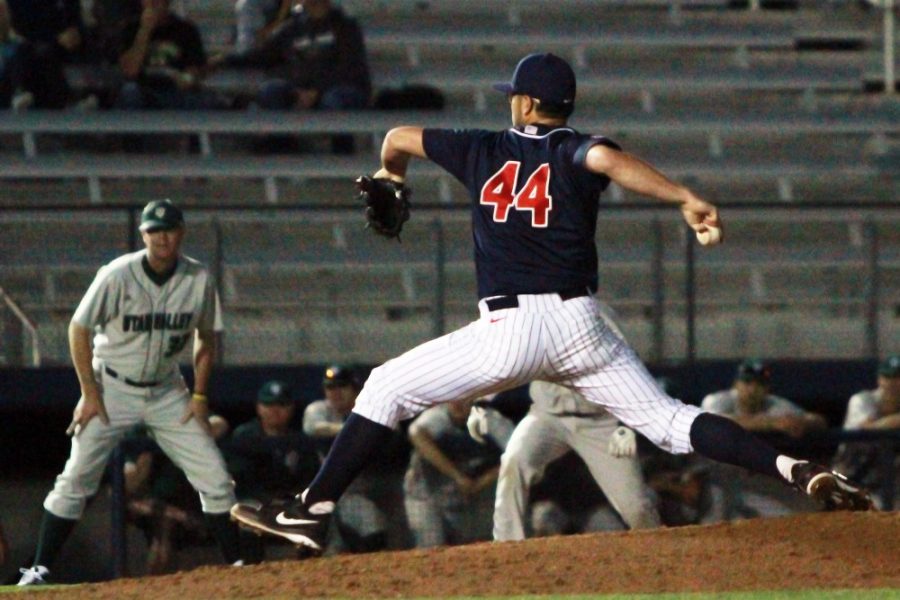 Cecilia Alvarez/ The Daily Wildcat

Junior pitcher Mathew Troupe pitches the ball during Arizonas 8-7 victory against Utah Valley at Hi Corbett Field on Tuesday, Feb. 18.