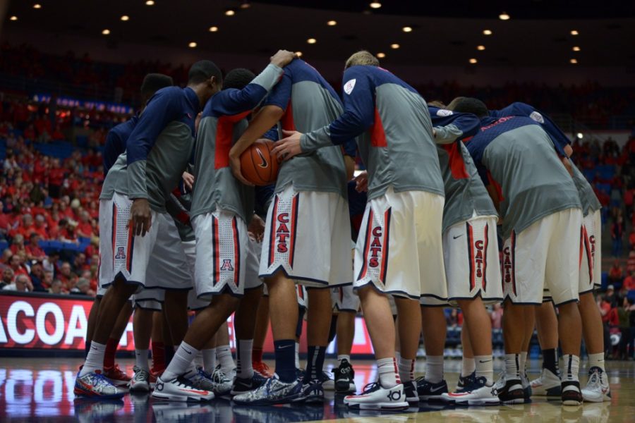 Tyler Baker / The Daily Wildcat

The UA mens basketball team huddles together before a game against ASU on Jan. 16. The mens basketball team suffered their first loss on Saturay against Berkeley University. 