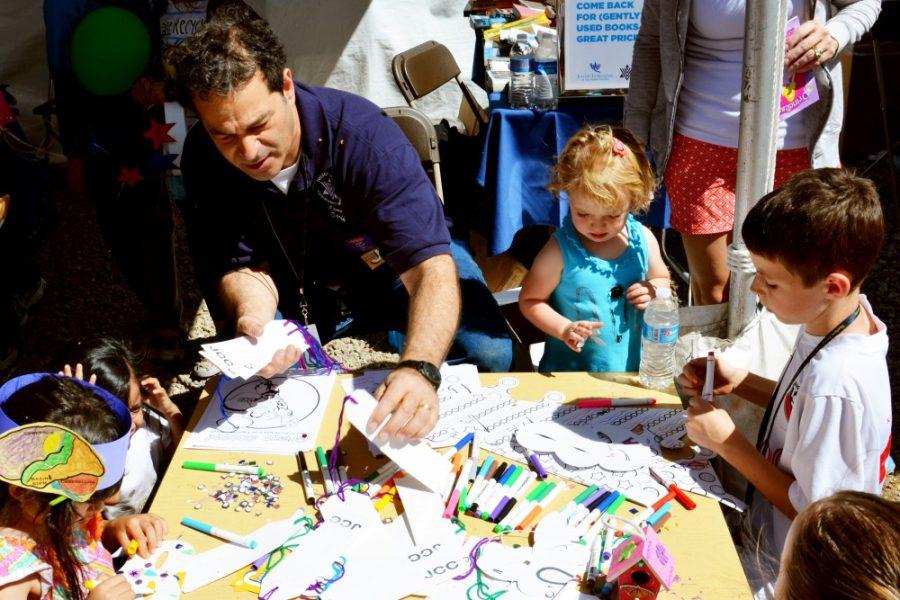 Rebecca Noble/ The Daily Wildcat

Scott Zorn, an employee of the Tucson Jewish Community Center for almost 10 years, helps children with arts and crafts. 