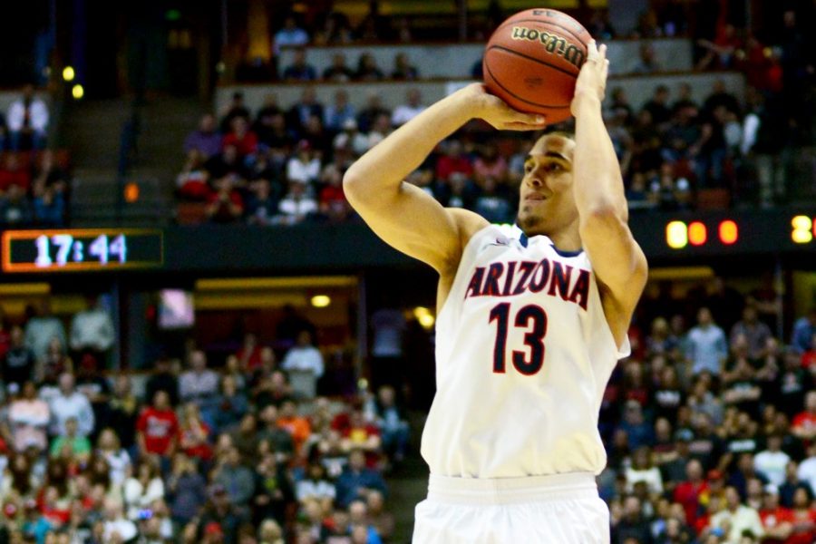 	Arizona junior guard Nick Johnson (13) shoots a jump shot during Arizona’s 70-64 win over San Diego State in the Sweet Sixteen at the Honda Center in Anaheim, Calif. The Pac-12 player of the year earned Arizona’s shooting guards an “A” in the Daily Wildcat’s 2013-14 grades.