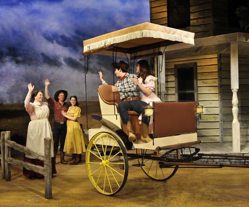 	Courtesy of Ed Flores / 

	During the final scene of “Oklahoma!”, Curly (Michael Calvoni) & Laurey (Silvia Vannoy) say good-bye to Aunt Eller (Kylie Arnold), Will Parker (Ryan Kleinman), & Ado Annie (Lindsey Mony). The Arizona Repertory Theatre’s production of the Tony Award-nominated musical closed Sunday.