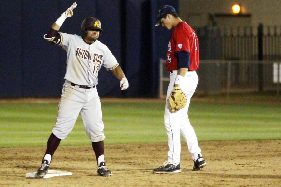 Arizona freshman utility player Bobby Dalbec reacts in disgust as ASU junior infielder Drew Stankiewicz celebrates an RBI double during Arizonas 7-0 loss against ASU at Hi Corbett Field on Saturday. The Wildcats lost the season and Pac-12 series to the Sun Devils.