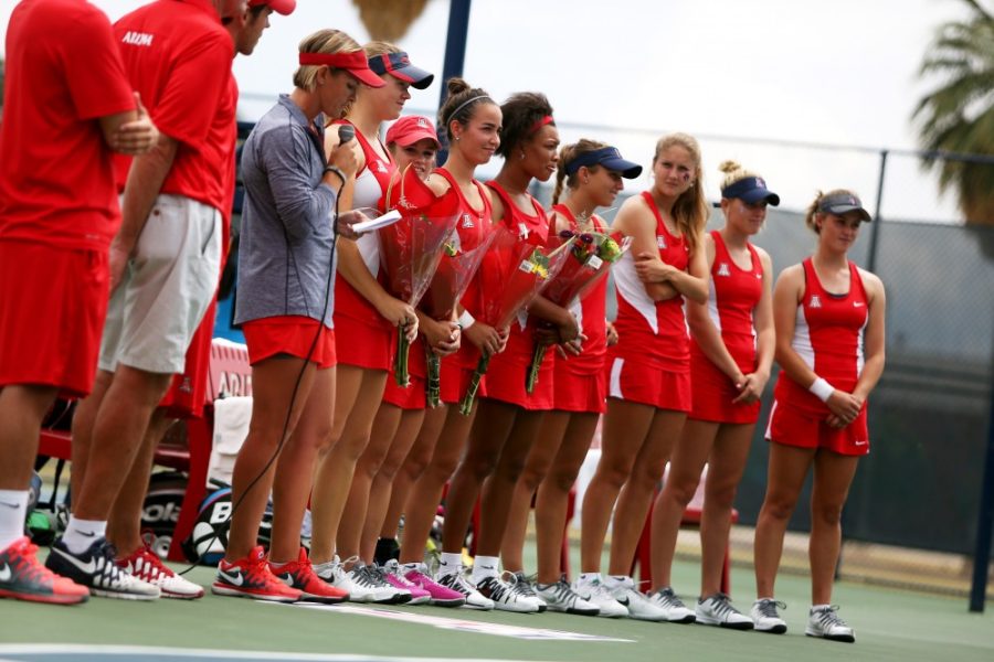Womens+Tennis+Head+Coach+Vicky+Maes+recognizes+the+four+seniors+during+senior+night+by+giving+each+senior+flowers%2C+a+poster+with+photos+and+years+and+a+hearfelt+speech+before+Arizonas+4-2+win+against+ASU+at+LaNelle+Robson+Tennis+Center+on+Saturday.+The+four+senior+athletes+are+Susan+McRann%2C+Lacey+Smyth.+Kim+Stubbe+and+Akilah+James.