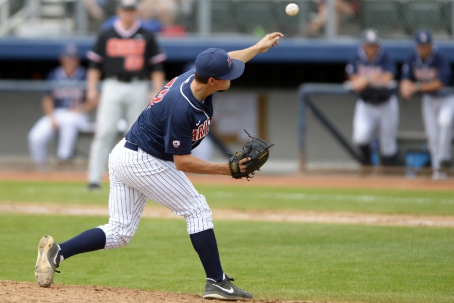 Carlos Herrera / The Daily Wildcat

Arizona Freshman pitcher Evan Hebert (27) pitches a ball to Oregon State pitcher/outfielder Dylan Davis (10) during Arizonas 11-0 loss against Oregon State on Sunday at Hi Corbett Field.
