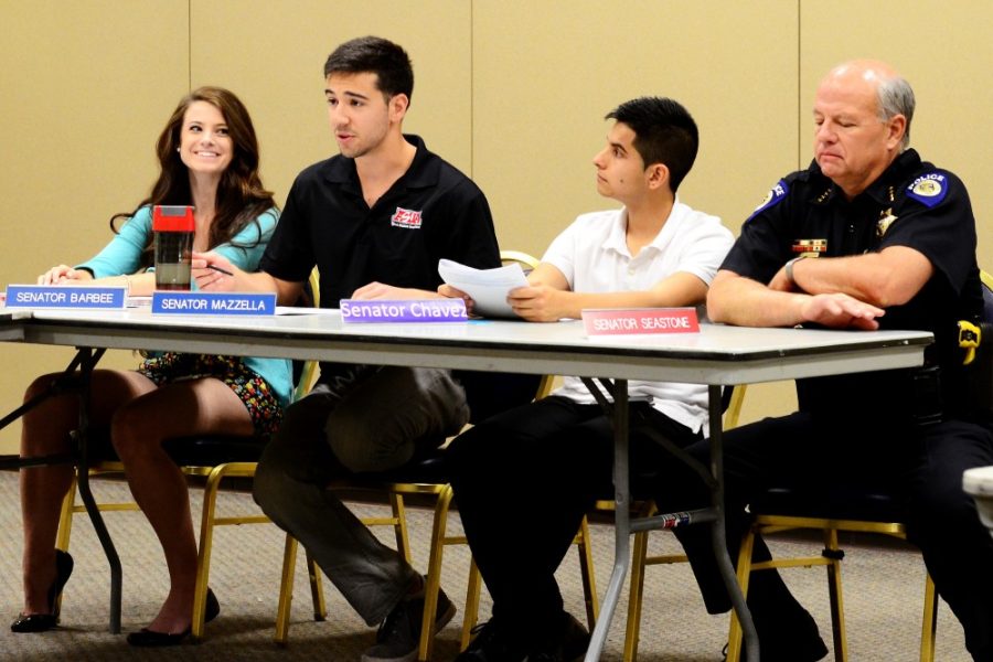 	Sen. Michael Mazzella (second left) briefs the Associated Students of the University of Arizona Senate on the tobacco ban proposal at the senate meeting on Wednesday in the Student Union Memorial Center. Included are (left to right) Sen. Alex Barbee, Sen. Christopher Chavez.