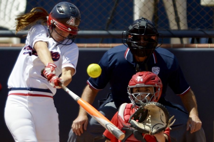 	Arizona junior utility Hallie Wilson (5) hits a solo home run during Arizona’s 8-3 win against Utah at Hillenbrand Stadium on Sunday. The Wildcats have won six in a row.