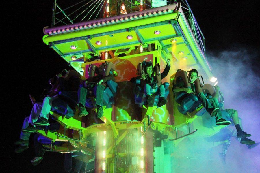 	<p>People attending the Pima County Fair on Saturday night enjoy the Mega Drop attraction. The fair has an average attendance of 250,000 people each year. </p>