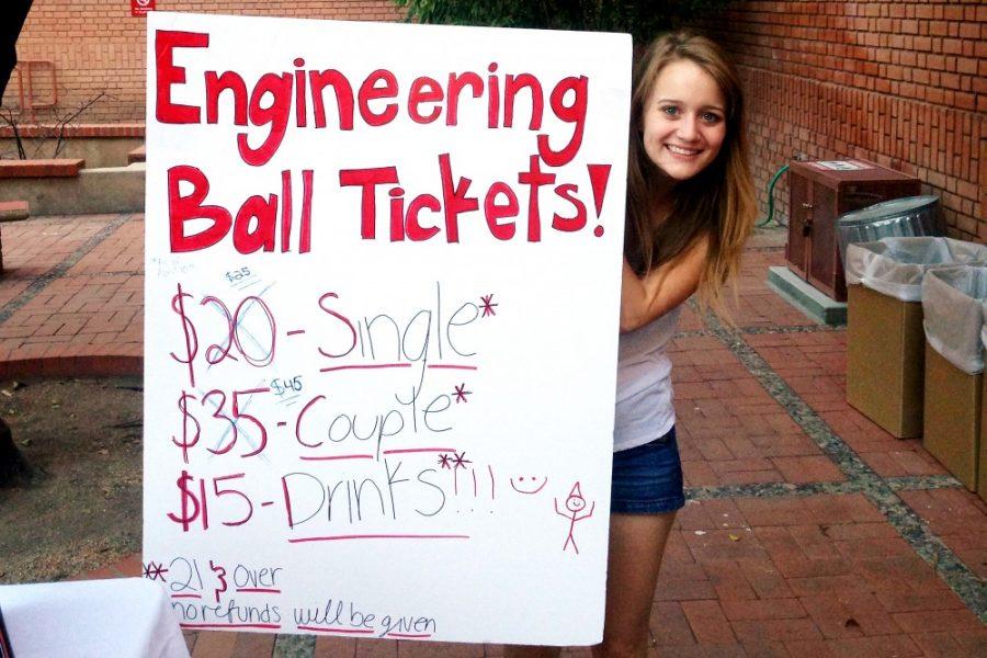 Courtesy of Ari Auerbach 

Ericka Tucker, a mining engineering sophomore, holds up a sign informing the price of tickets for the First Annual Engineering Student Council Masquerade Ball. The ESC will be hosting a ball for the first time since the 1990s on May 10 at the Arizona Historical Society. 