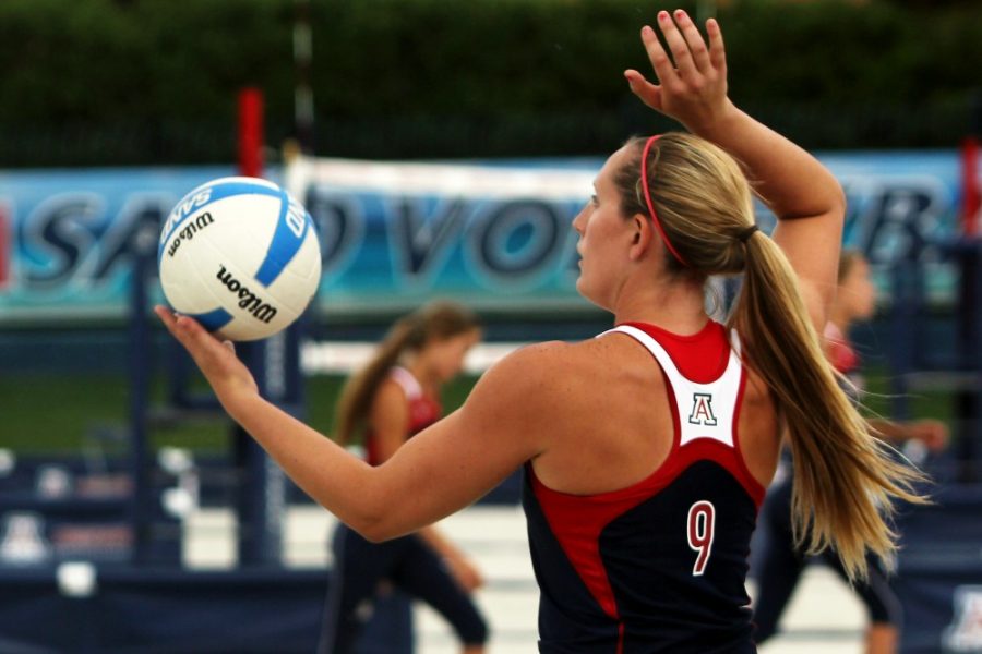 Arizona junior Madi Kingdon serves the ball during Arizonas 4-1 win over Boise State at the sand volleyball courts on Saturday. The Wildcats closed their first season with a win over the Broncos, despite windy conditions. 