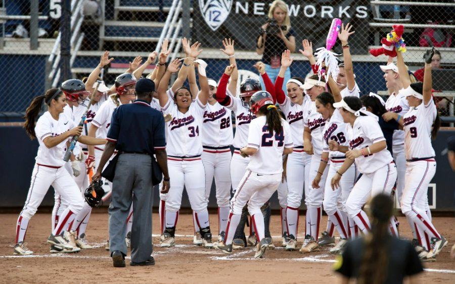 Carlos Herrera / The Daily Wildcat

Wildcats celebrate Kelsey Rodriguezs third inning two run homer at Hillenbrand Memorial Stadium on Thursday, May 8, 2014 in Tucson, Ariz. The No. 9 Wildcats fell to No. 1 Oregon, 7-3, in the first of three games at Hillenbrand.

