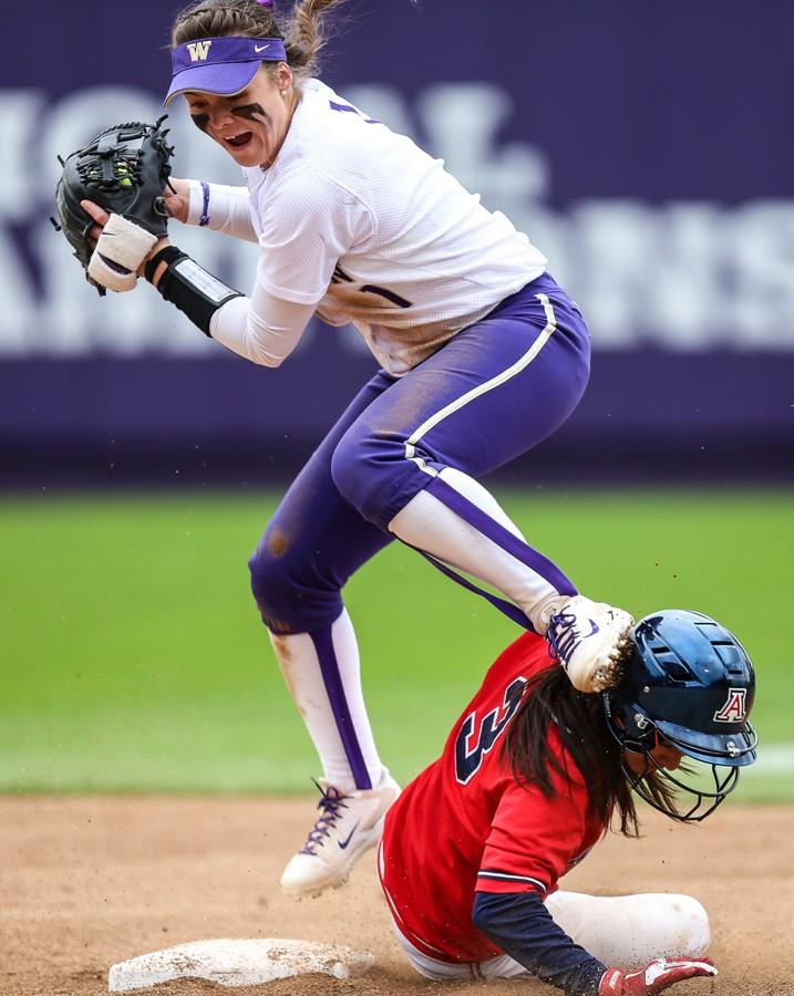 	Joshua Bessex at The Daily of the University of Washington /
Washington freshman Ali Aguilar tags Arizona redshirt junior Chelsea Suitos at second base during Arizona’s double header against Washington. Arizona lost 8-0 in five innings in the first game to lose the series, but won the final game 2-0. 