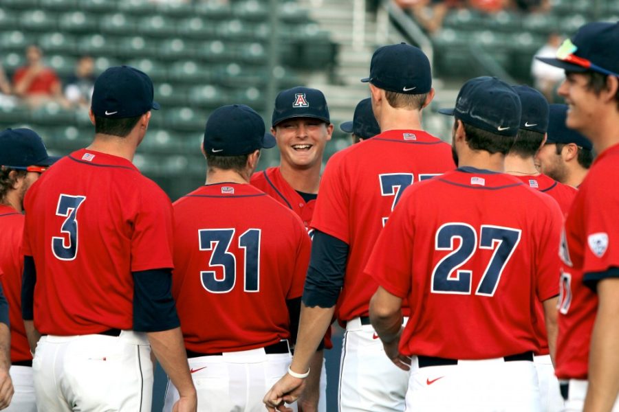 	James Farris, former Arizona pitcher, receives congratulations from his teammates after being awarded a framed T-shirt during Arizona baseball’s senior night on May 24 at Hi Corbett Field. Farris was drafted in the 9th round of the 2014 MLB Draft by the Chicago Cubs. 