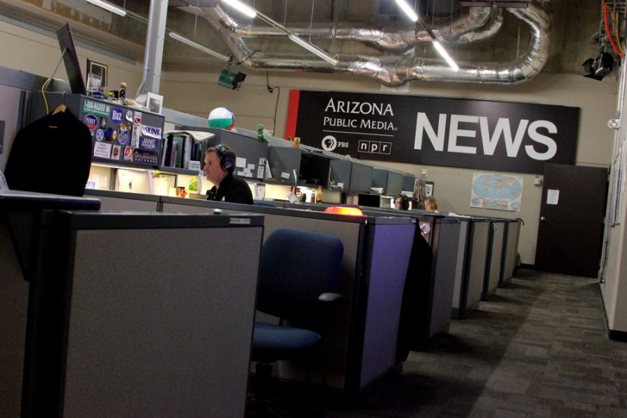 	Radio and television reporters work on stories in the Arizona Public Media newsroom Tuesday. AZPM received budget cuts for the upcoming UA semester and will be losing $400,000 a year for the next five years. 