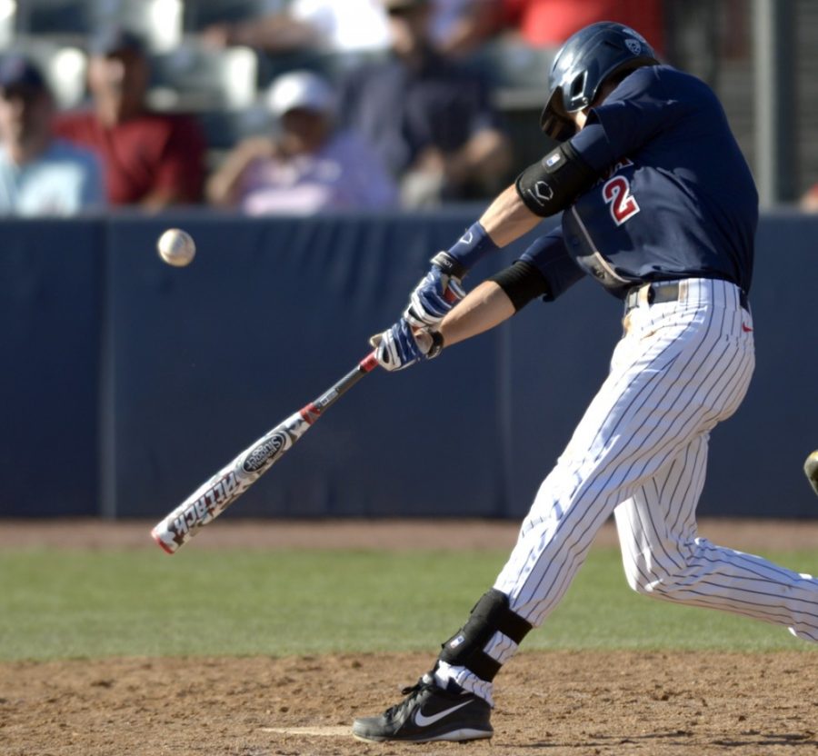 	Arizona infielder Kevin Newman hits a base hit during Arizona’s 6-5 win against UCLA at Hi Corbett Field. Newman is one of three Arizona Wildcats to be named an all-star in the 2014 Cape Cod Baseball League. 