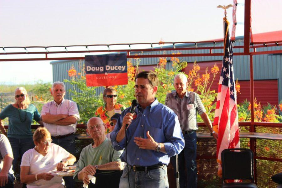 	Doug Ducey, Arizona state treasurer, speaks with voters at a meet and greet at Hotrods Old Vail. Ducey is running for Arizona governor in a crowded Republican primary field.