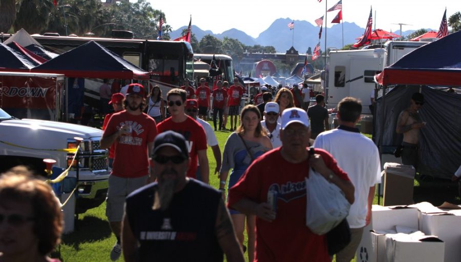 	UA fans tailgated on the mall before Arizona’s season opener against UNLV at Arizona Stadium. Then greeted the team on Cherry Avenue for the Wildcat Walk. 