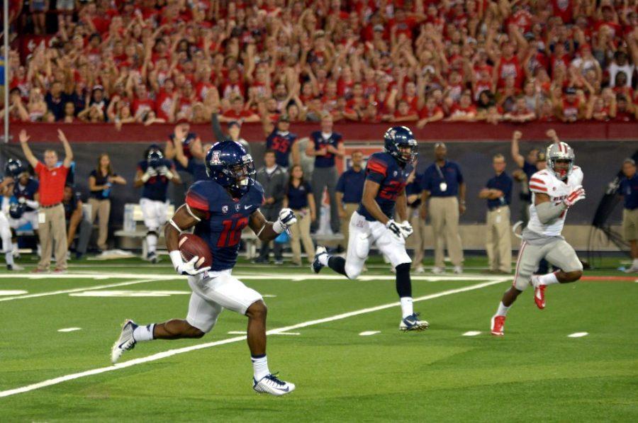 	Arizona sophomore wide receiver Samajie Grant (10) runs for a touchdown during the first half of Arizona vs. UNLV football game at Arizona Stadium on Friday, Aug. 29. The Wildcats beat the Rebels 58-13.