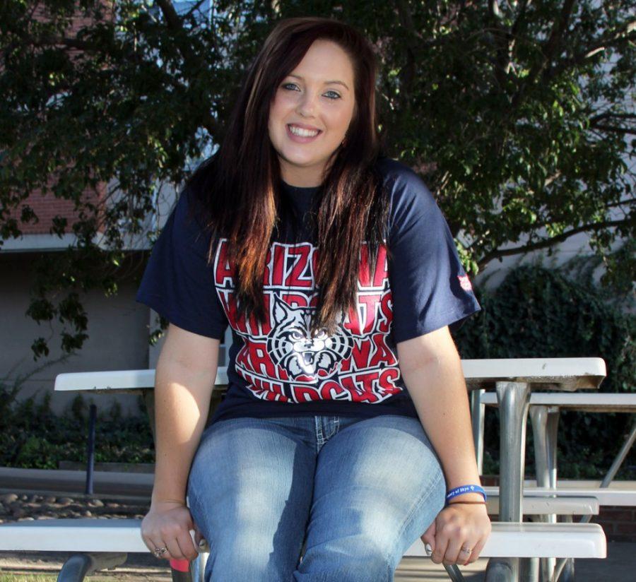 	Tatum Seebaum, a pre-business freshman, who was in kindergarten when the 9/11 attacks took place, re-creates her kindergarden photo by sitting on a bench outside of Park Student Union on Wednesday. This year’s college freshmen were in kindergarten when 9/11 happened.