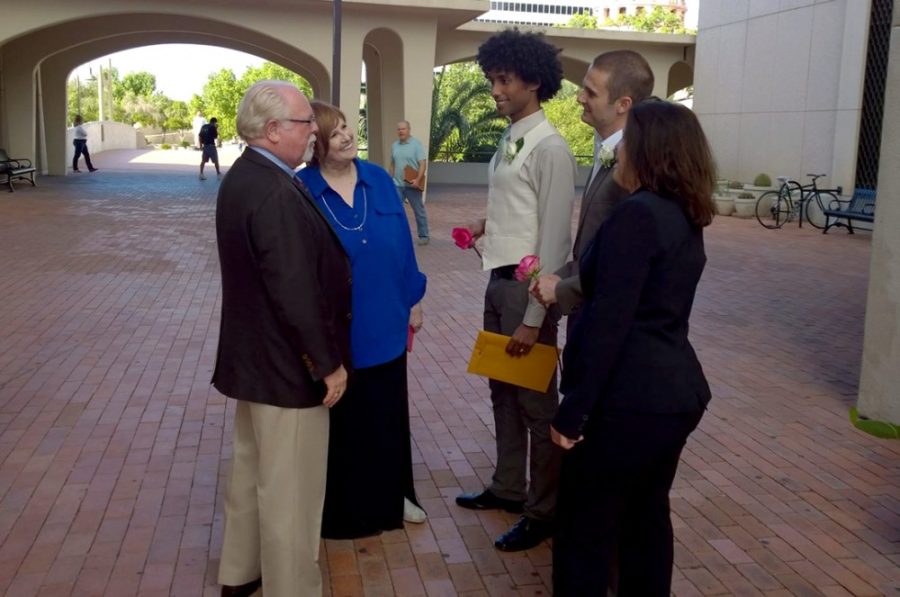 Courtesy of Dustin CoxDemocratic Rep. Ron Barber (left) talks with Dee Barclay (center left) — grandmother of Dustin Cox — newlyweds Aaron Singleton and Dustin Cox, (center right), and Stefanie Mach — minister and former roommate — before Singleton and Cox say their vows in front of the Arizona Superior Court in Pima County on Friday.