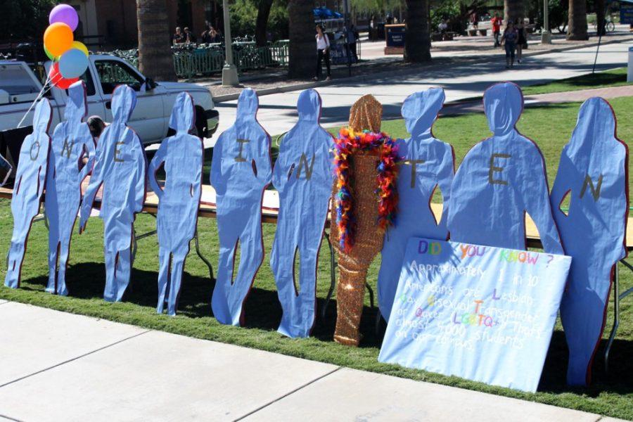 Cardboard cutouts are placed on the UA Mall depicting the lesbian, gay, bisexual, transgender and questioning community during Coming Out Week. Coming Out Week addresses the difficulties that the LGBTQ community faces when coming out and celebrates and embraces the identities withinin the community.